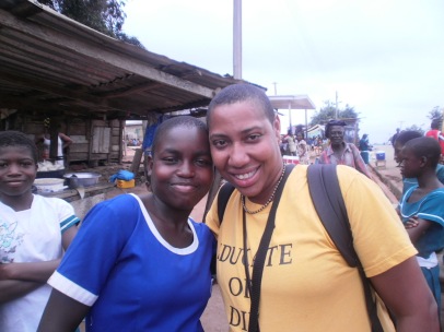 Aysha Butler with student in Abira